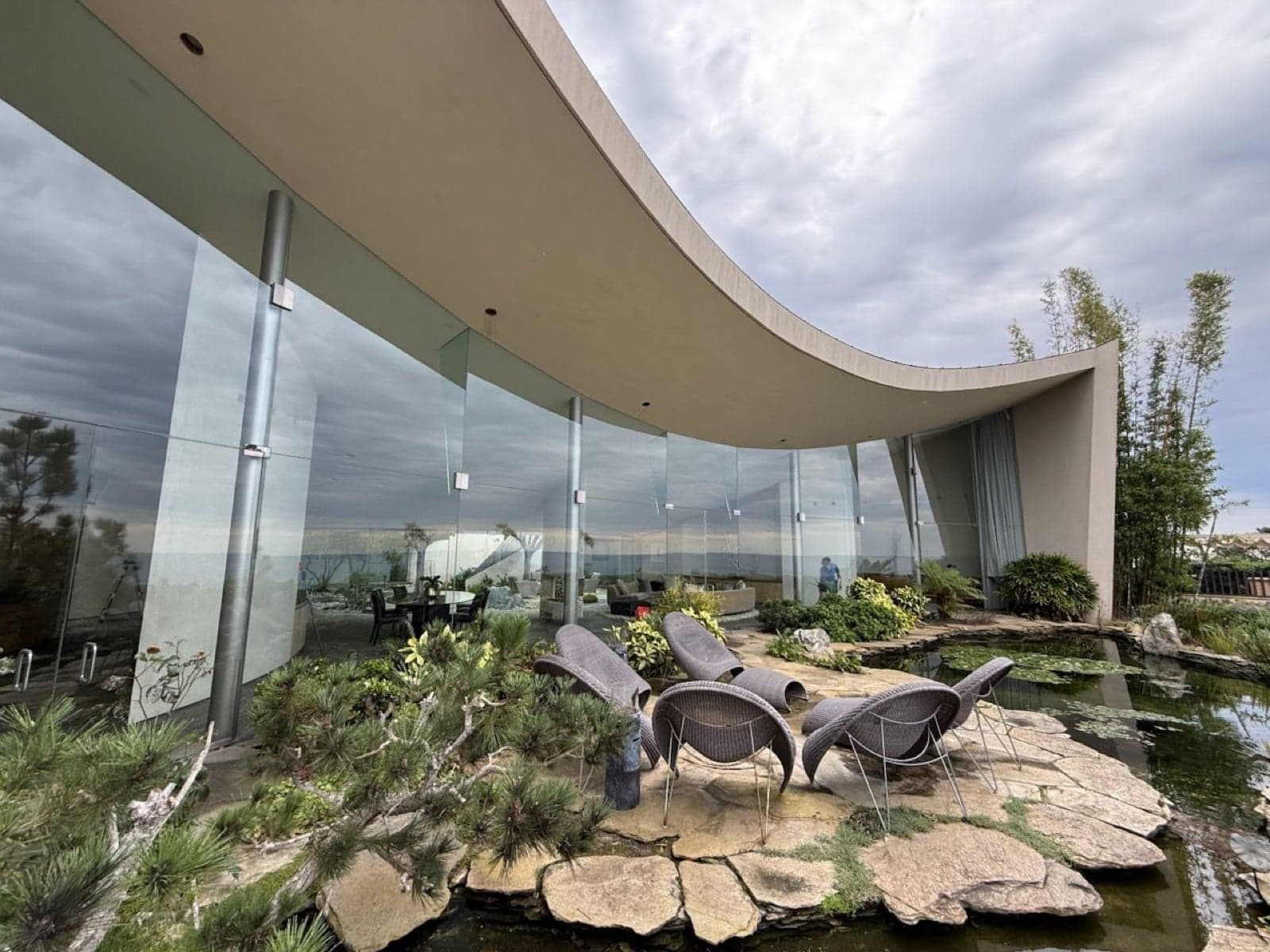Coastal Clarity technician cleaning windows with eco-friendly products